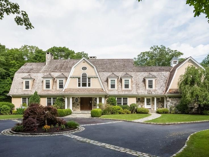 299 Ridgefield Road Wilton, CT 06897 - Photo 1 of 29 a front view of a residential apartment building with a yard