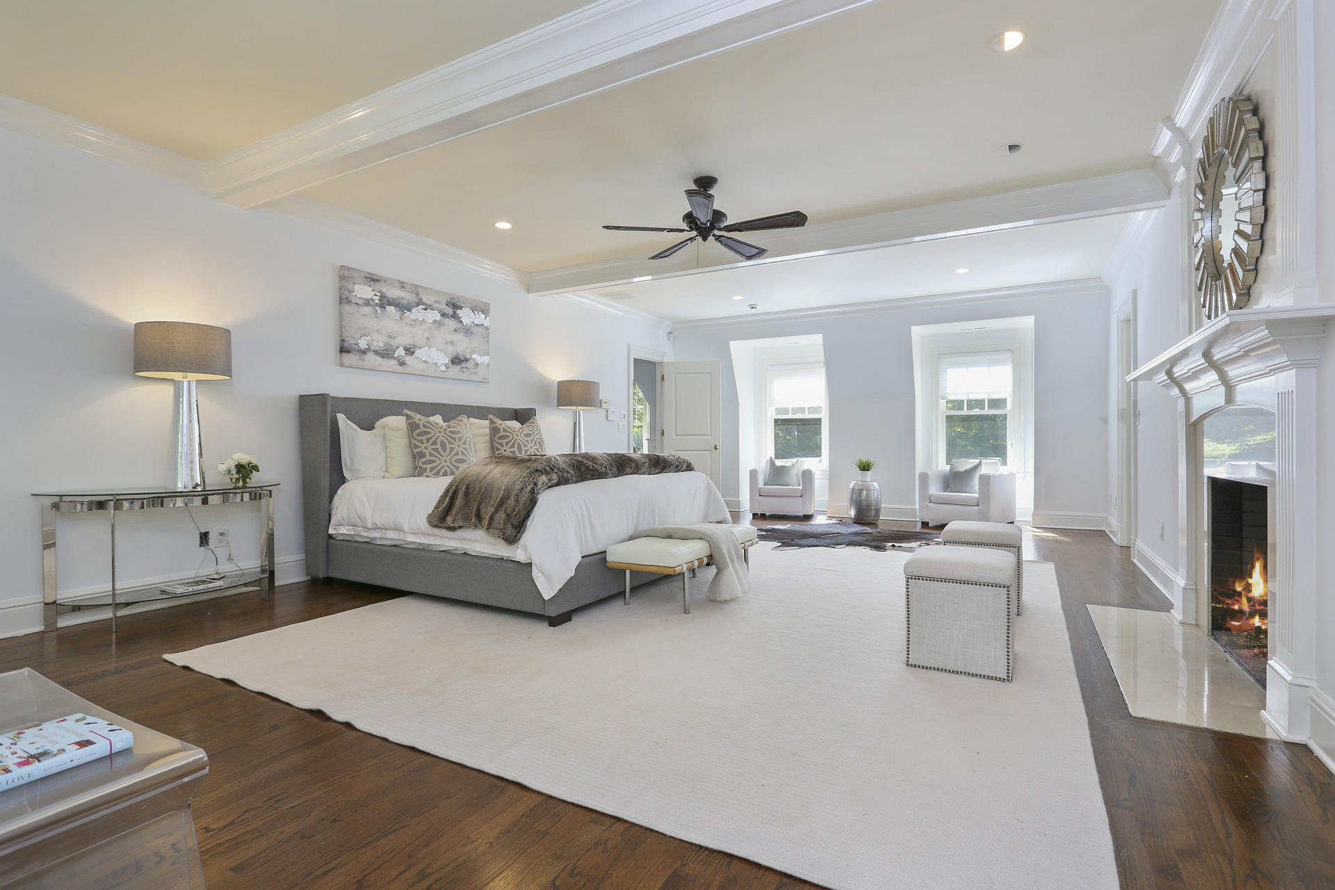 299 Ridgefield Road Wilton, CT 06897 - Photo 15 of 29 a bedroom with a large bed and a chandelier