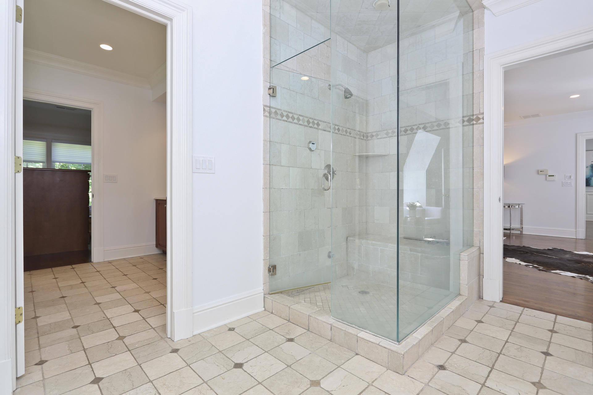 299 Ridgefield Road Wilton, CT 06897 - Photo 17 of 29 a bathroom with a glass shower door