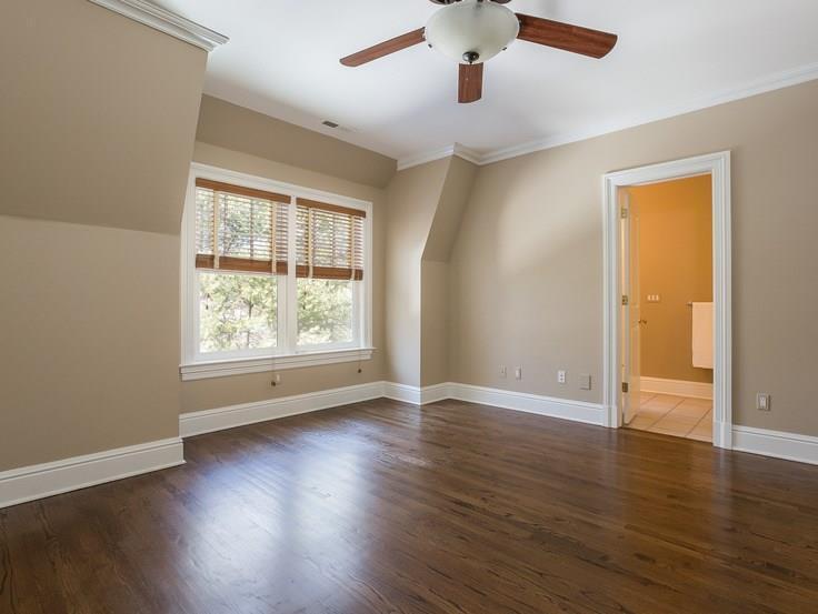 299 Ridgefield Road Wilton, CT 06897 - Photo 19 of 29 an empty room with wooden floor and windows