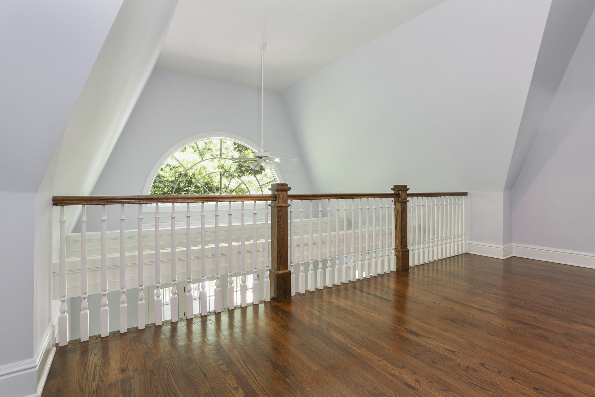 299 Ridgefield Road Wilton, CT 06897 - Photo 20 of 29 an empty room with wooden floor and windows