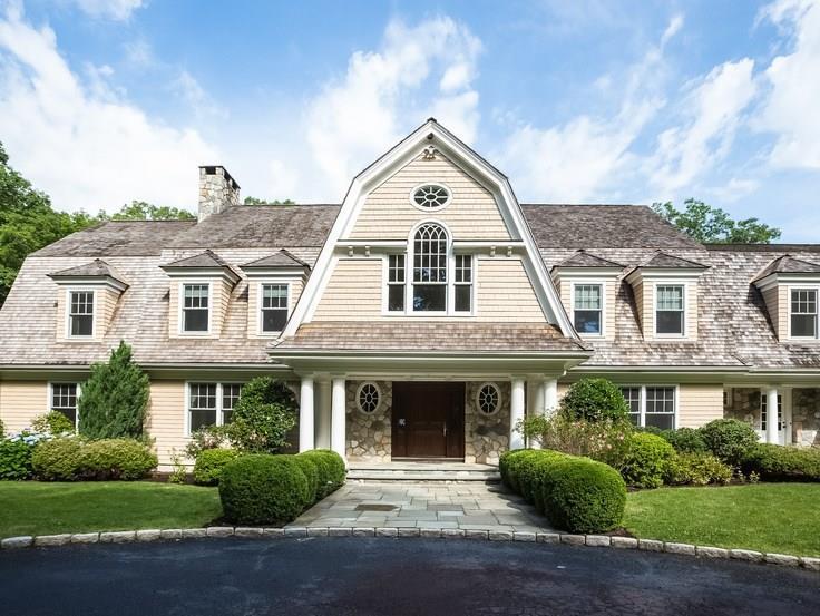 299 Ridgefield Road Wilton, CT 06897 - Photo 2 of 29 a front view of a house with garden