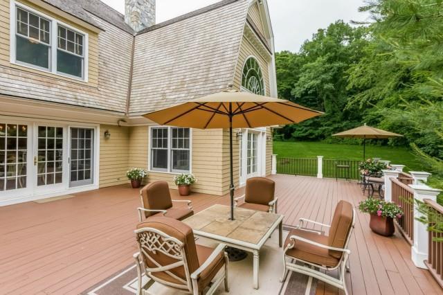 299 Ridgefield Road Wilton, CT 06897 - Photo 24 of 29 a view of backyard with seating space and wooden deck