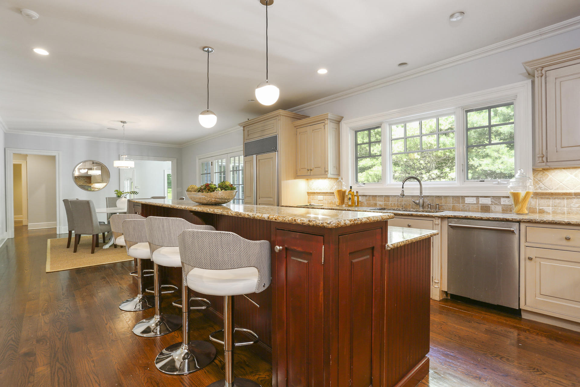 299 Ridgefield Road Wilton, CT 06897 - Photo 7 of 29 a kitchen with a counter space dining table and a large window