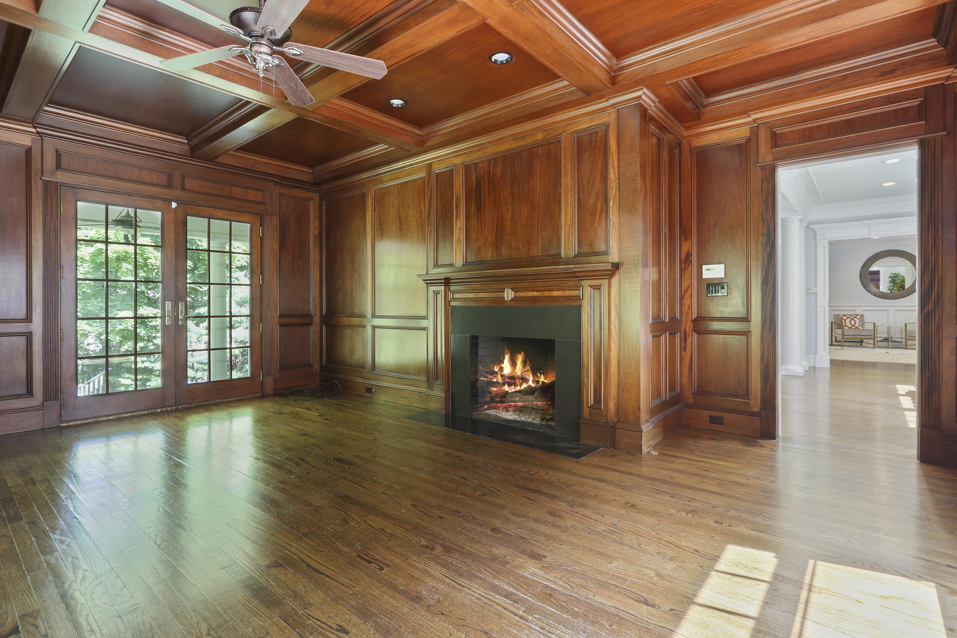 299 Ridgefield Road Wilton, CT 06897 - Photo 10 of 29 a view of an empty room with wooden floor fireplace and a window