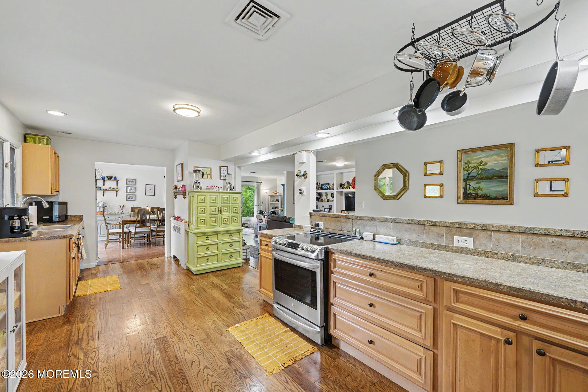 699 Aldrich Road Howell, NJ 07731 - Photo 2 of 30 a view of a kitchen with a sink a microwave and cabinets