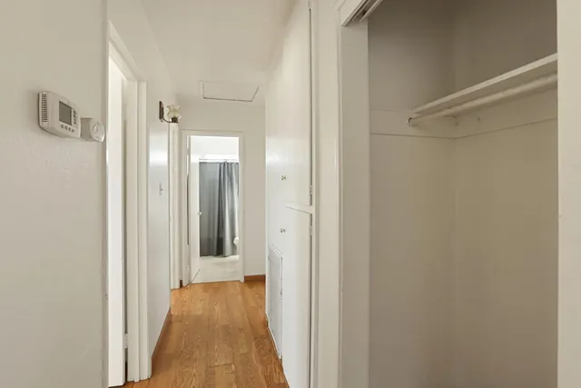 a view of a bathroom from a hallway