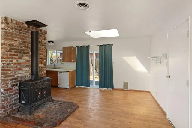 a view of a kitchen with furniture and a window
