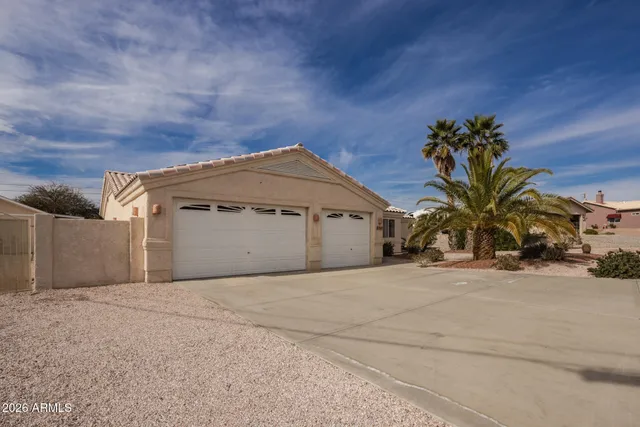 a view of a house with backyard porch and sitting area