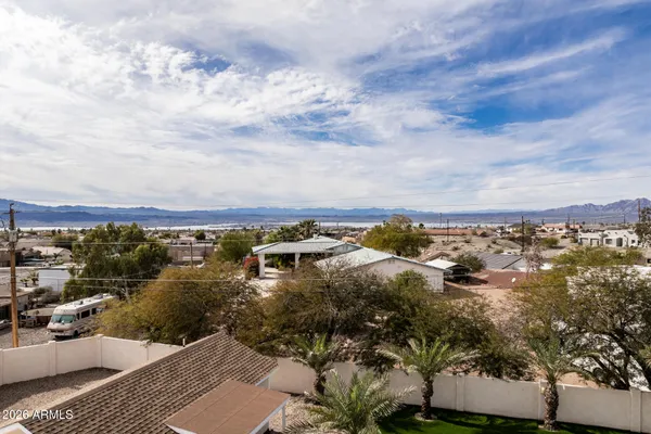 a living room with furniture fireplace and a table