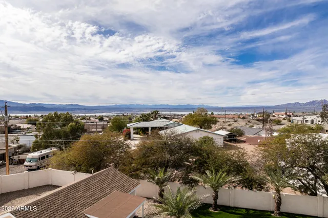 a living room with furniture fireplace and a table