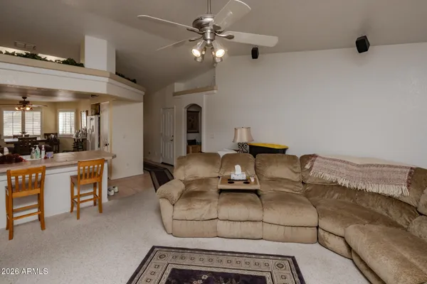 a living room with fireplace furniture and a flat screen tv