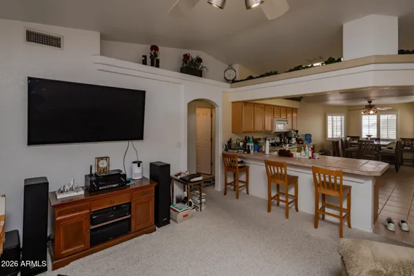 a view of a dining room with furniture window and outside view