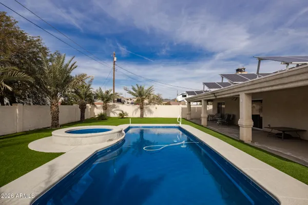 a view of a patio with swimming pool