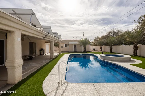 a view of a house with swimming pool