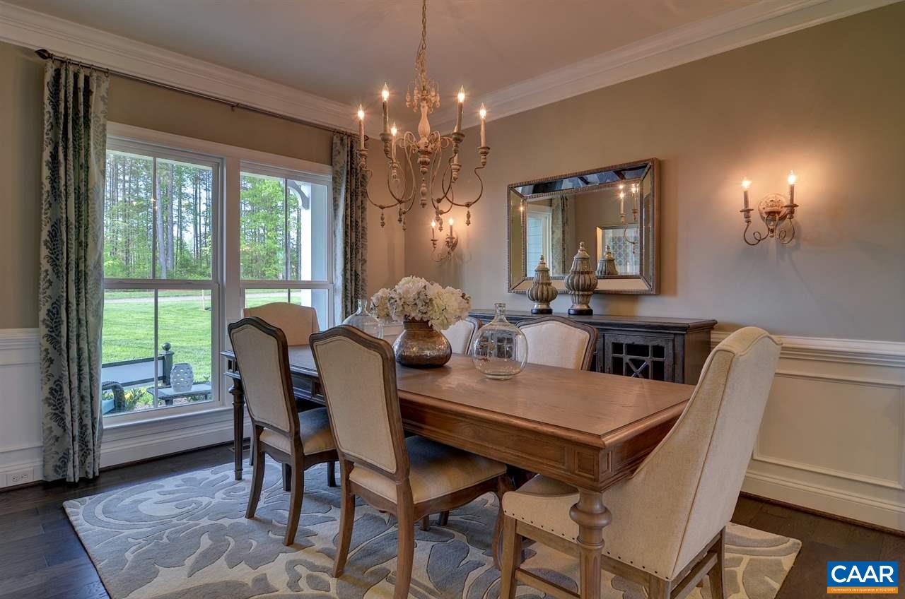 216 Ridgemont Road Ruckersville, VA 22968 - Photo 8 of 12 a view of a dining room with furniture and chandelier