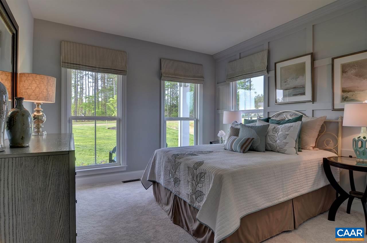 216 Ridgemont Road Ruckersville, VA 22968 - Photo 10 of 12 a bedroom with a bed and windows