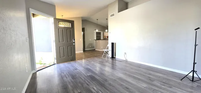 a view of a livingroom with wooden floor