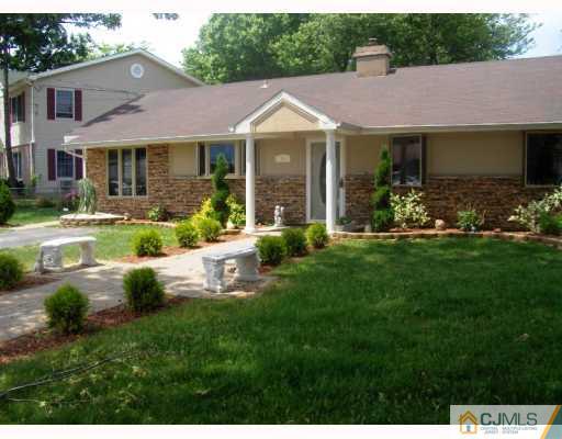 35 Windsor Road Edison, NJ 08817 - Photo 1 of 10 a front view of a house with a yard table and chairs