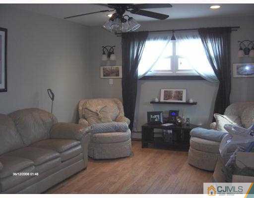35 Windsor Road Edison, NJ 08817 - Photo 3 of 10 a living room with furniture and a large window