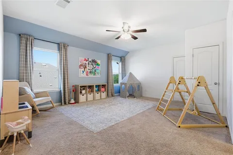 a room with gym equipment and white walls