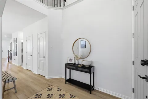 a living room with furniture and a mirror