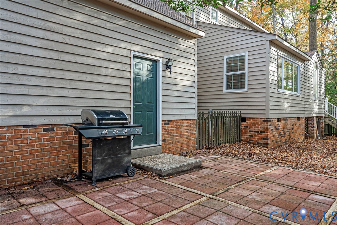 13905 North Point Road Midlothian, VA 23112 - Photo 42 of 50 Look at this beautiful brick patio off the garage!