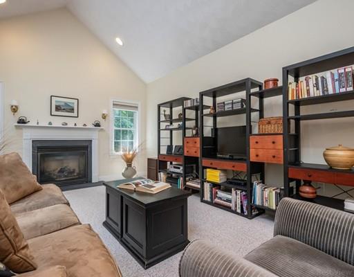 337 Springs Road Bedford, MA 01730 - Photo 11 of 30 a living room with furniture and a fireplace