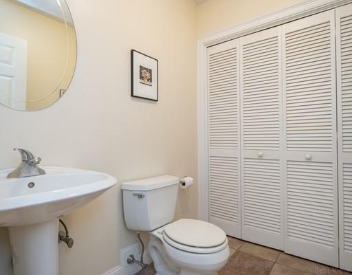 337 Springs Road Bedford, MA 01730 - Photo 14 of 30 a bathroom with a toilet a sink and mirror