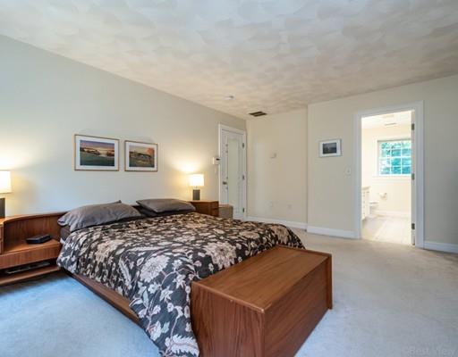 337 Springs Road Bedford, MA 01730 - Photo 16 of 30 a bedroom with a bed and a couch