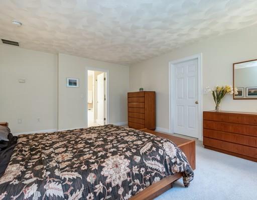 337 Springs Road Bedford, MA 01730 - Photo 17 of 30 a bedroom with a bed and a closet