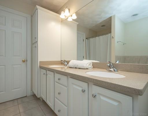 337 Springs Road Bedford, MA 01730 - Photo 20 of 30 a bathroom with a double vanity sink and a mirror