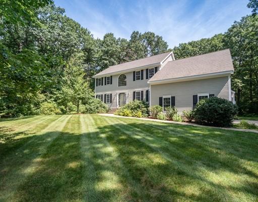 337 Springs Road Bedford, MA 01730 - Photo 2 of 30 a view of a house with a big yard potted plants and large tree