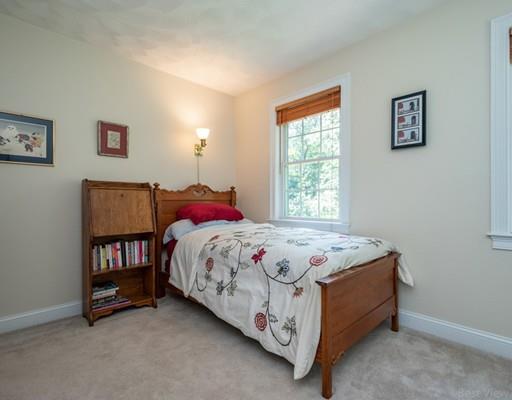 337 Springs Road Bedford, MA 01730 - Photo 21 of 30 a bedroom with a bed and a window