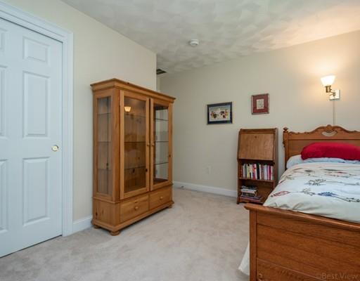 337 Springs Road Bedford, MA 01730 - Photo 22 of 30 a bed room with a bed and a window