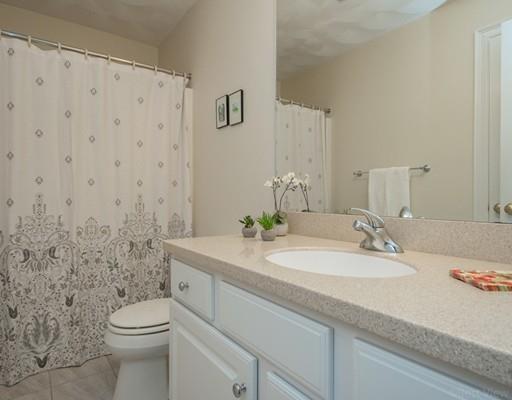 337 Springs Road Bedford, MA 01730 - Photo 26 of 30 a bathroom with a granite countertop sink mirror and toilet