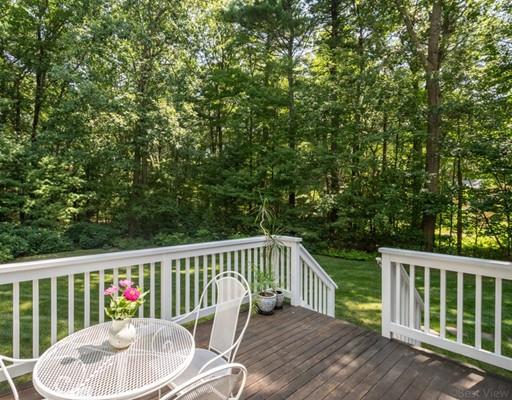 337 Springs Road Bedford, MA 01730 - Photo 28 of 30 a view of a chair and table on the wooden floor