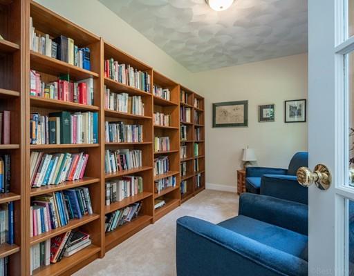337 Springs Road Bedford, MA 01730 - Photo 6 of 30 a living room with furniture and a book shelf