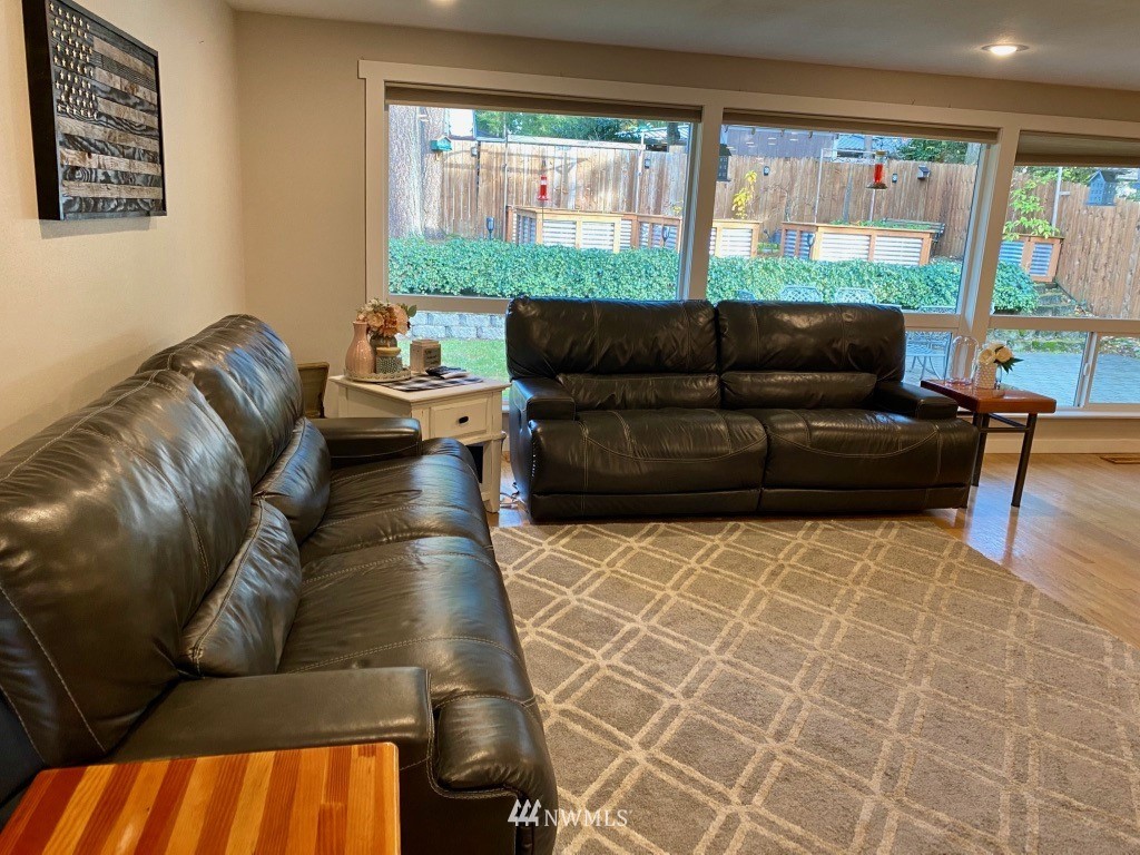 14530 166th Place Southeast Renton, WA 98059 - Photo 11 of 30 a living room with furniture and large windows