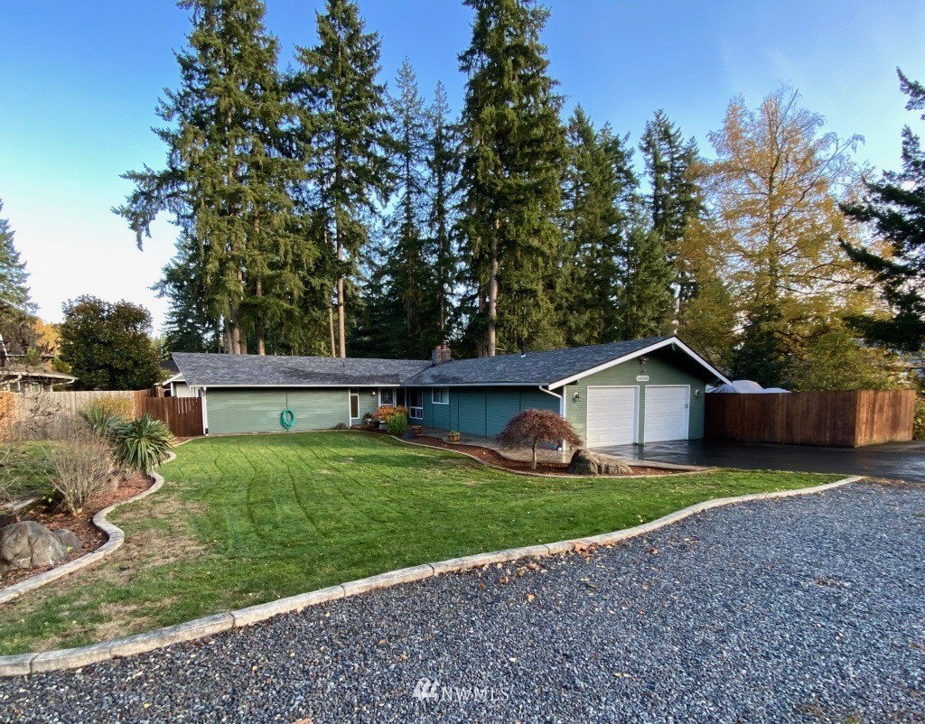 14530 166th Place Southeast Renton, WA 98059 - Photo 2 of 30 a view of a house with a yard and large tree