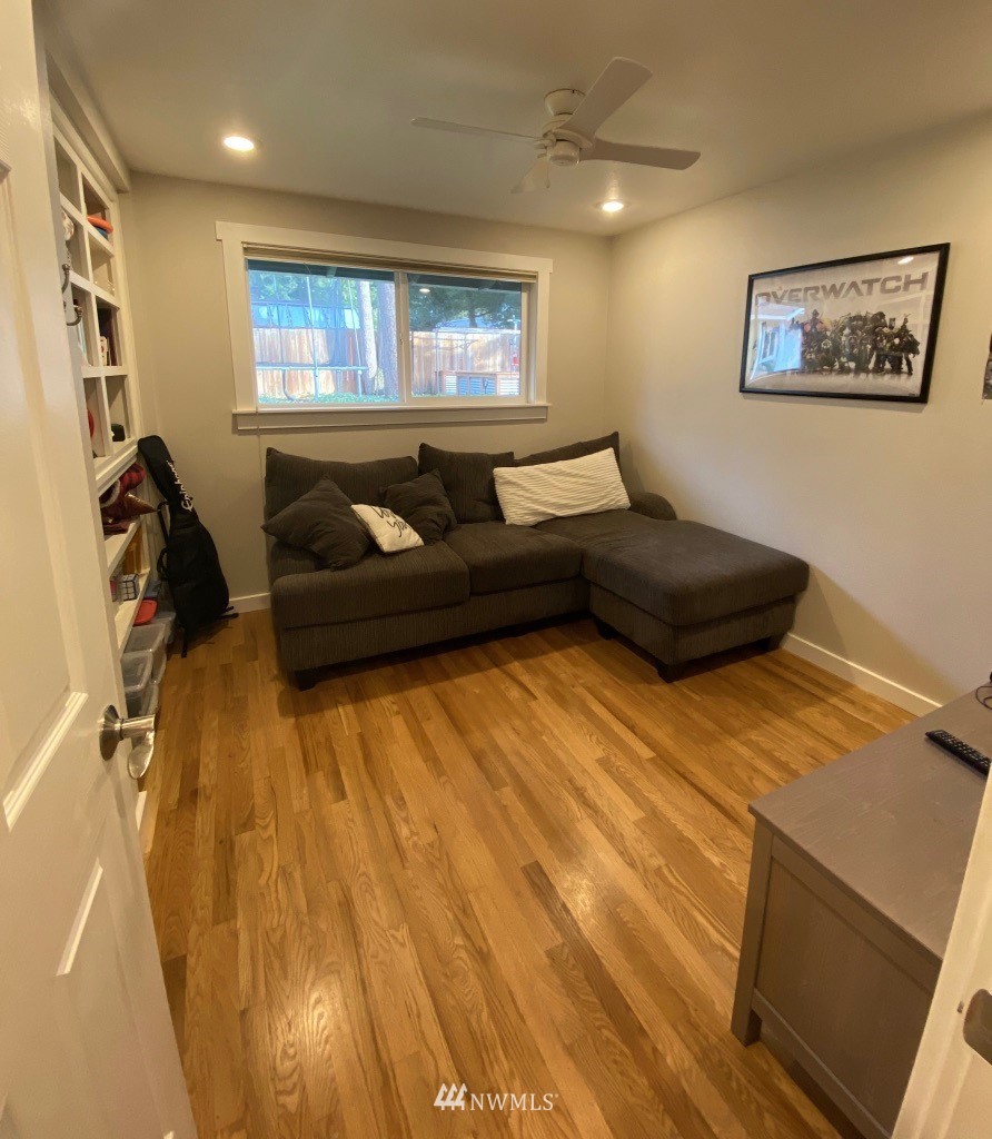 14530 166th Place Southeast Renton, WA 98059 - Photo 23 of 30 a living room with furniture and a flat screen tv