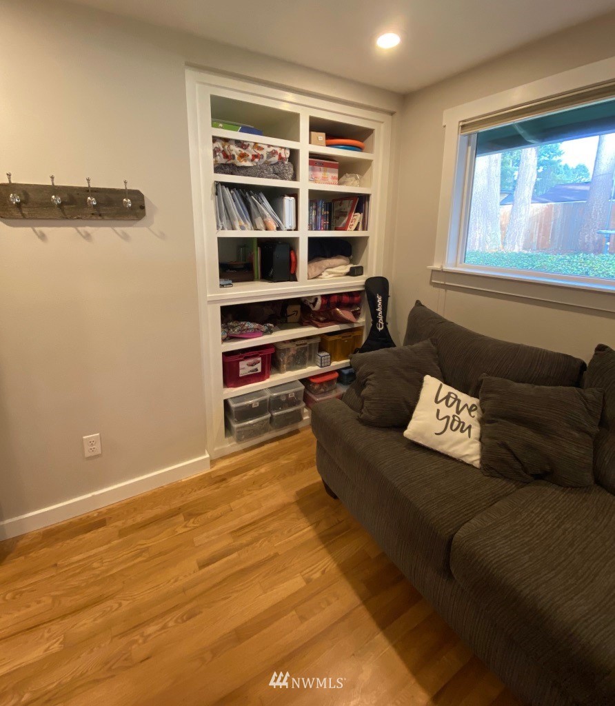 14530 166th Place Southeast Renton, WA 98059 - Photo 24 of 30 a living room with furniture and a book shelf