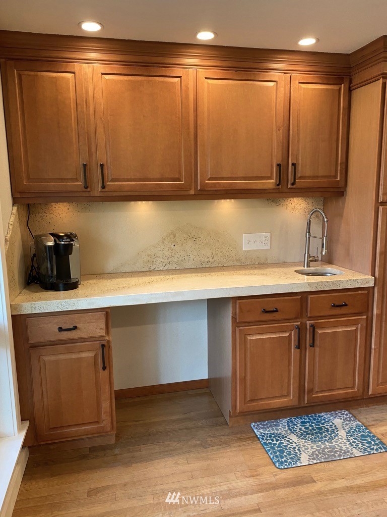 14530 166th Place Southeast Renton, WA 98059 - Photo 7 of 30 a kitchen with stainless steel appliances granite countertop a sink a stove and cabinets