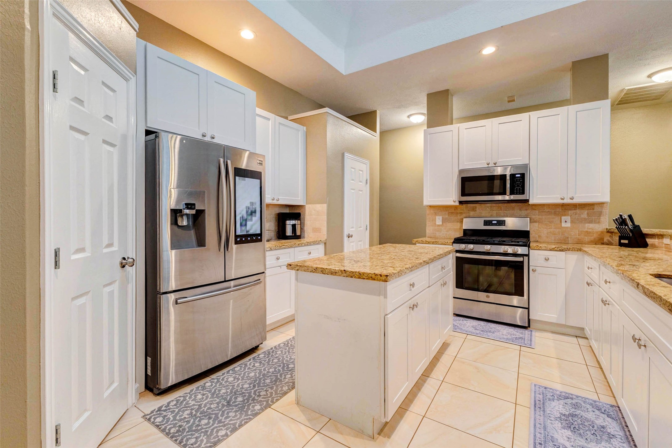 6334 Sampras Ace Court Spring, TX 77379 - Photo 17 of 48 Kitchen offers a pantry and also a broom closet for additional storage