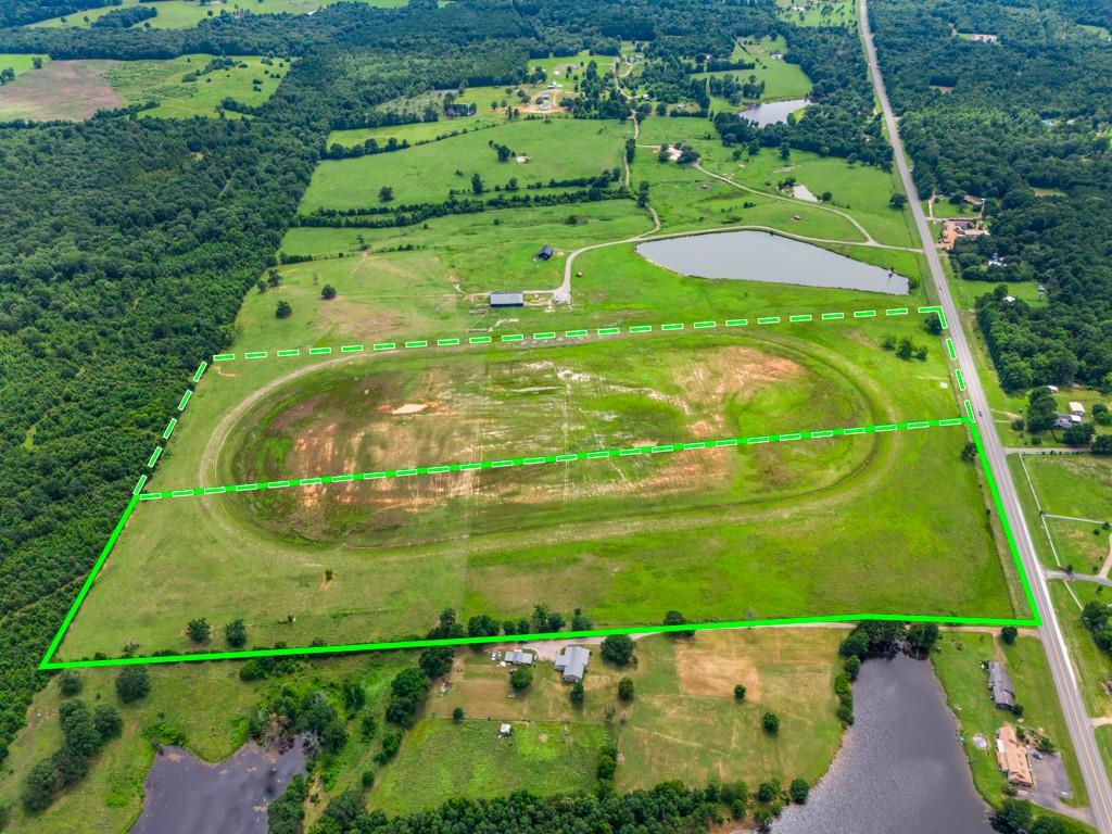 1 State Highway Ore City, TX 75683 - Photo 21 of 24 an aerial view of a golf course with a garden