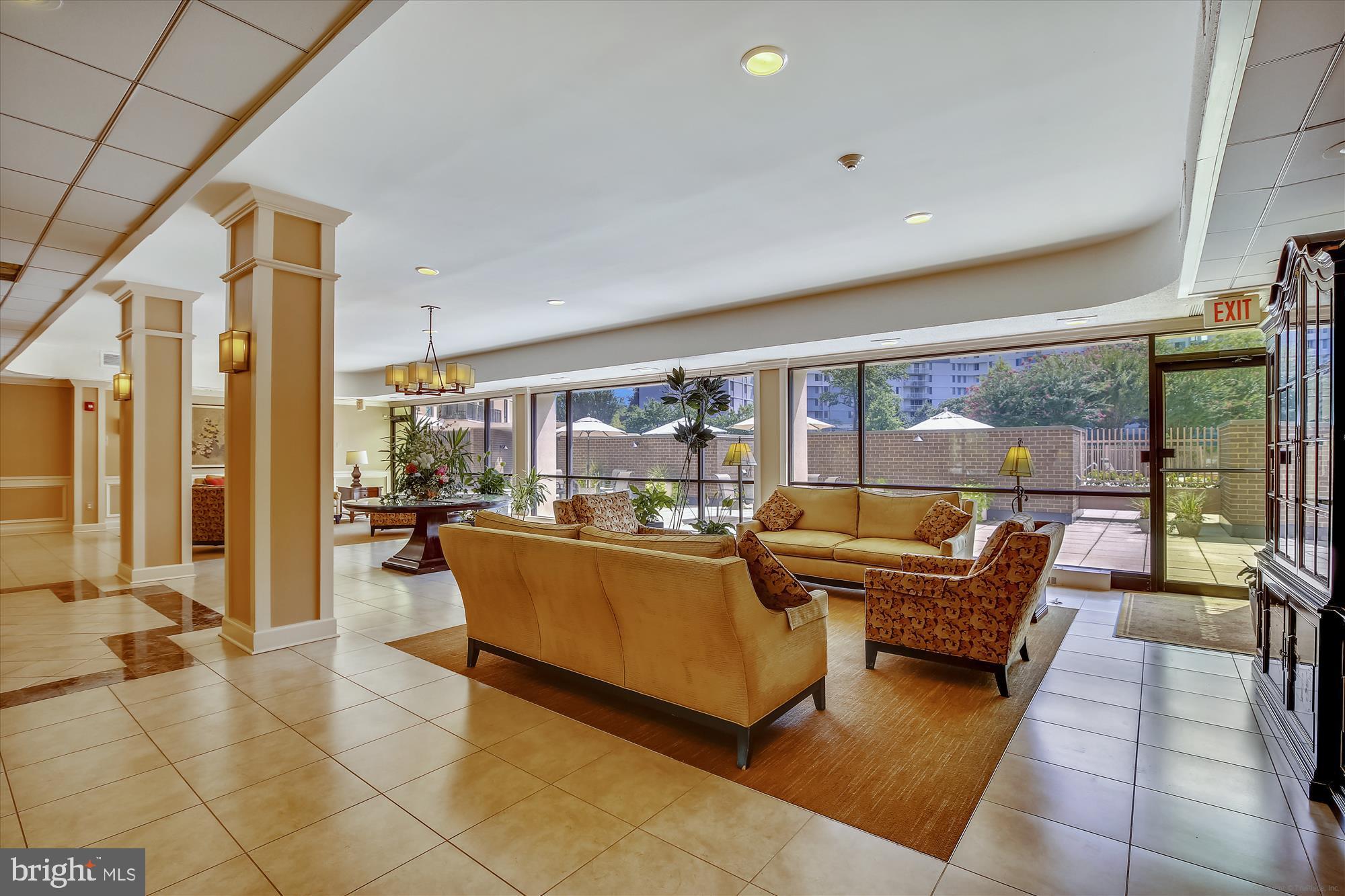 6800 Fleetwood Road, Unit 1004 McLean, VA 22101 - Photo 26 of 40 Inviting lobby with natural light and greenery.