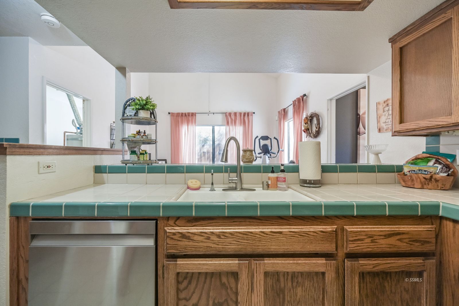 425 Mt Shasta Circle Ridgecrest, CA 93555 - Photo 4 of 47 a kitchen with stainless steel appliances granite countertop a sink and a microwave
