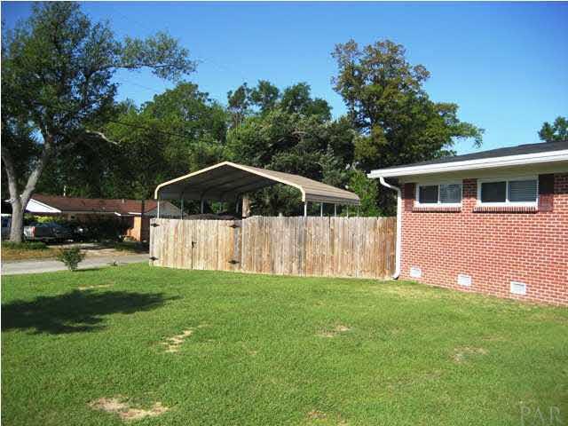 6357 Shady Lane Milton, FL 32570 - Photo 18 of 21 Awning behind privacy fence for a boat, 4 wheeler, etc