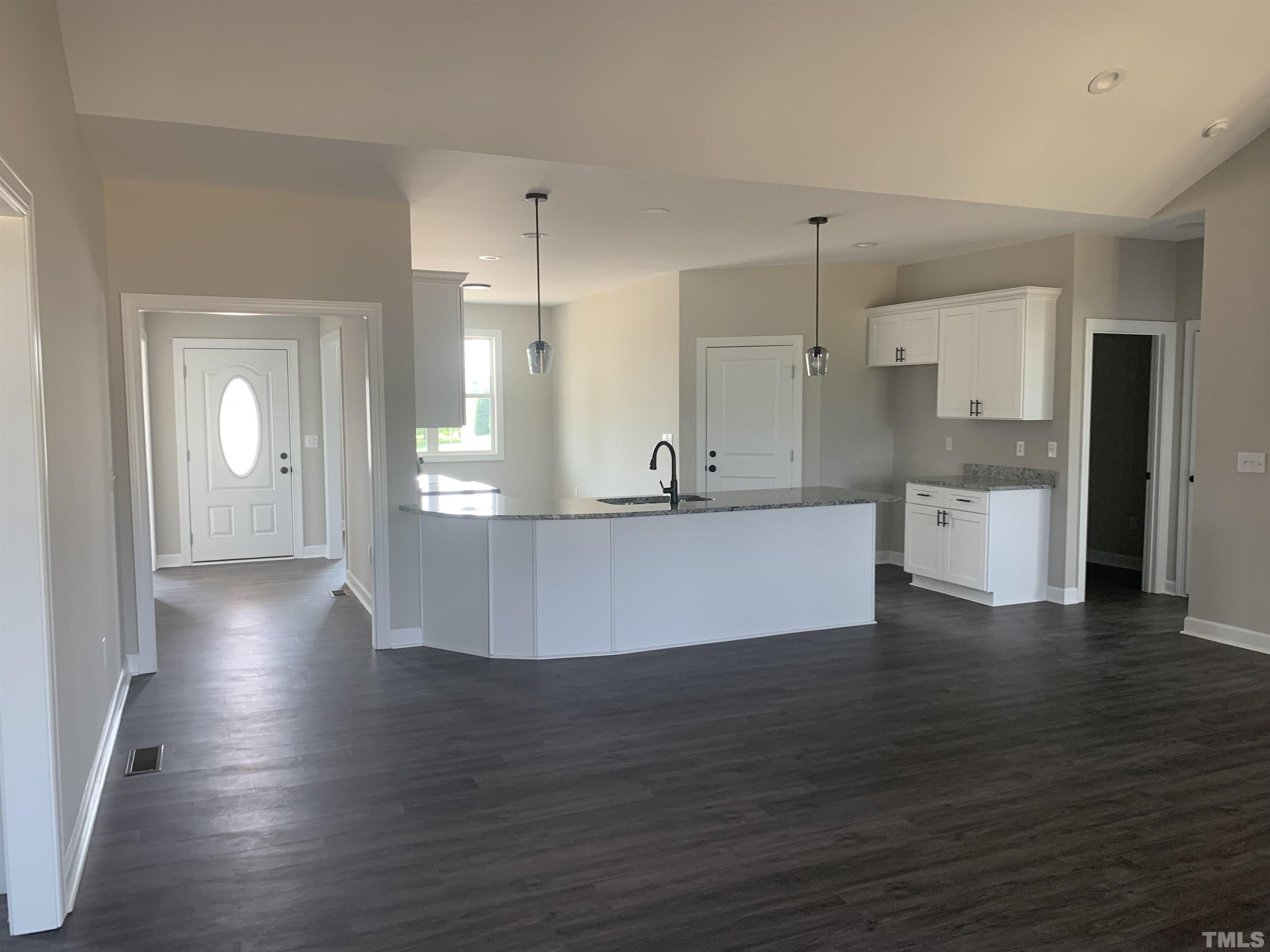 51 Knight Road Broadway, NC 27505 - Photo 3 of 5 a view of a kitchen with wooden floor and a window