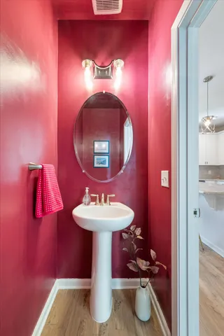 a bathroom with a sink and a mirror